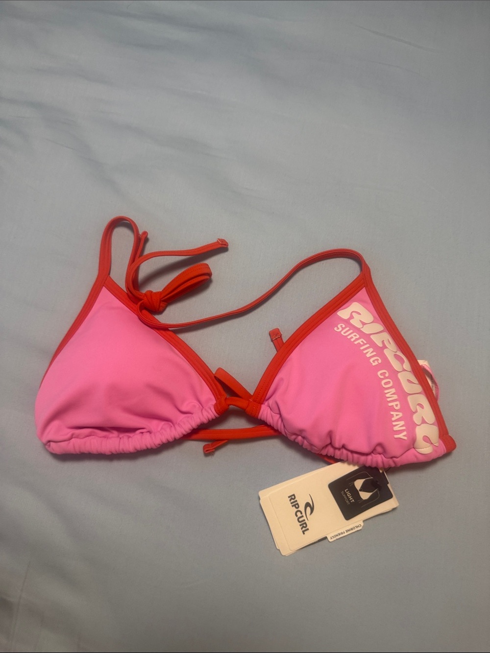 BNWT Rip Curl Pink Bikini Top with Orange Trim and Puff logo, sz M